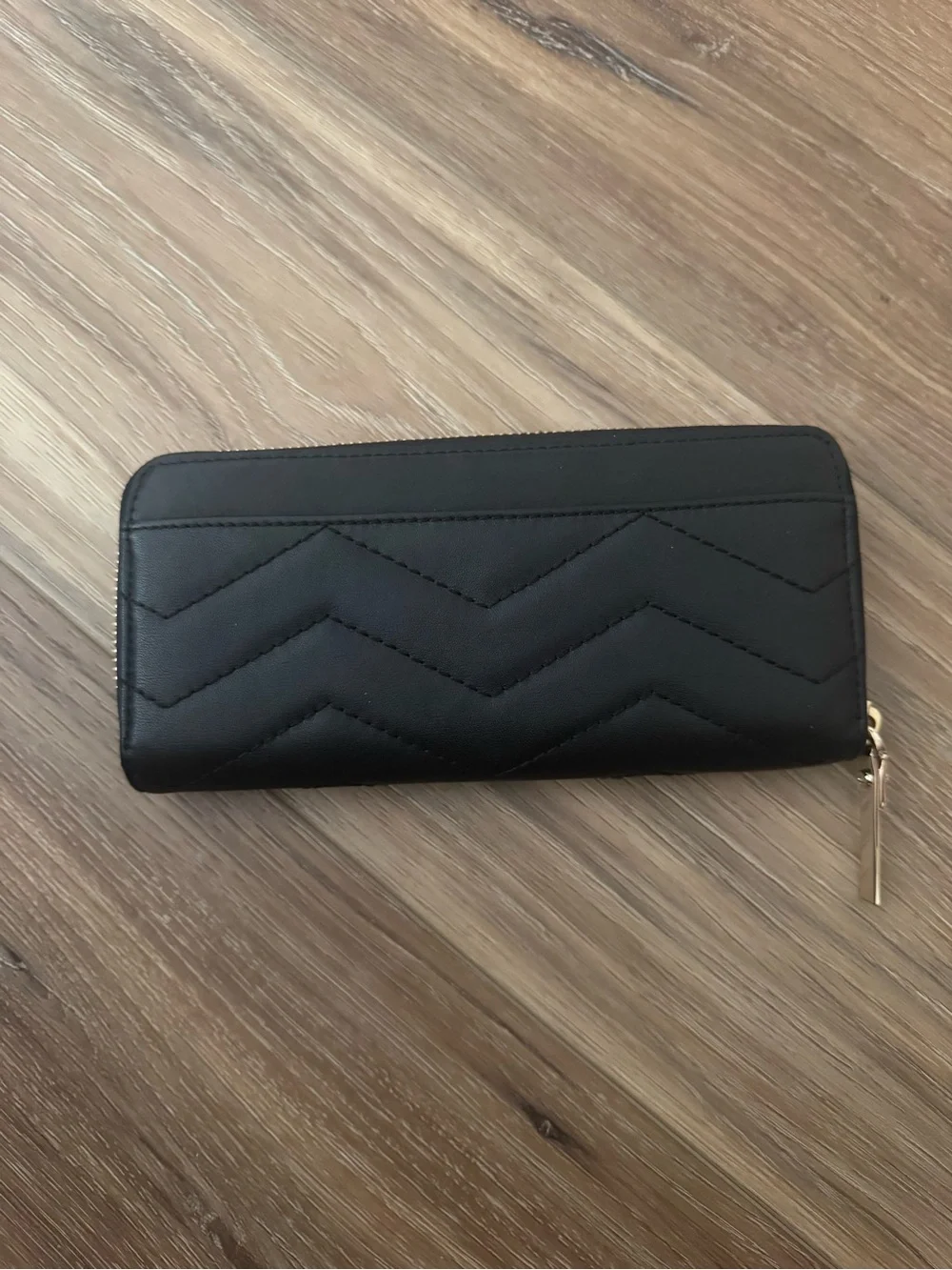 kate spade Black Quilted Chevron Zip-Around Wallet with Gold Logo